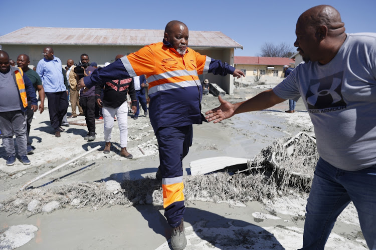 Minister of mineral resource Gwede Mantashe during a walkabout in Charlesville to inspect the damage caused to homes after the mudslide from the Jagersfontein Development mine dam damaged houses and infrastructure.