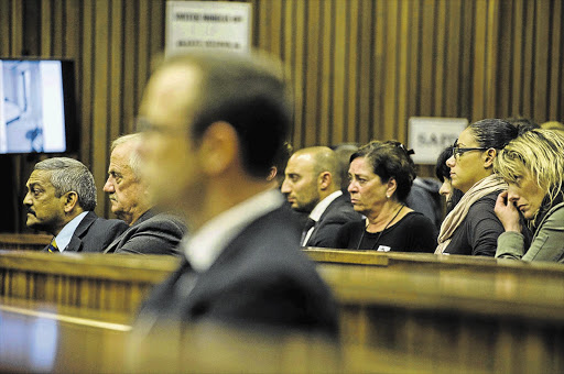 FINAL MOMENTS: Lieutenant-General Vinesh Moonoo, far left, and Reeva Steenkamp's friends, at the Oscar Pistorius murder trial in the Pretoria High Court yesterday