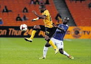 MISSING THE BALL: Bernard Parker of Kaizer Chiefs battling for the ball with Sandile Zule of Black Aces during their Absa Premiership match  at FNB Stadium in Johannesburg last night
        Photo: Veli Nhlapo