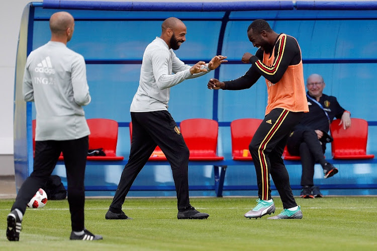 Belgium assistant coach Thierry Henry and Romelu Lukaku during training.