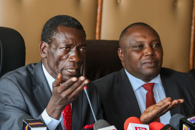 Kenya National Union of Teachers secretary general Collins Oyuu and national chairman Patrick Karinga during a press briefing on the demands tabled by the union on July 20, 2022, at the union's headquarters in Nairobi.