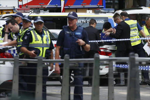 Police and emergency services personnel are seen after police cordoned off Bourke Street mal, after a car hit pedestrians in central Melbourne. Picture Credit: REUTERS/Edgar Su