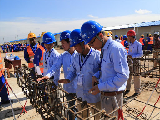 A file photo of Standard Gauge Railway (SGR) employees with officials of China Road and Bridge Corporation (CRBC) during an educational contest.