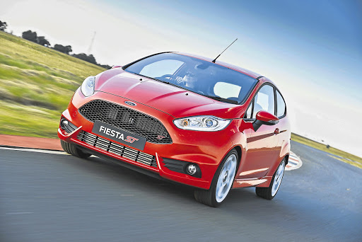 A black mesh grille and red ST logo set this hot Ford hatch apart from lesser Fiestas