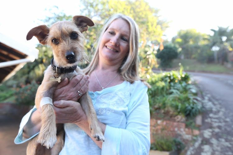 Morag Liebenberg with her lucky dog, Jasper, that killed a black mamba and survived the venom after having 4 vials of antivenom.