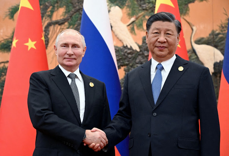 Russian President Vladimir Putin shakes hands with Chinese President Xi Jinping during a meeting at the Belt and Road forum in Beijing, China, on October 18, 2023. Picture: SPUTNIK/SERGEI GUNEEV/POOL via REUTERS