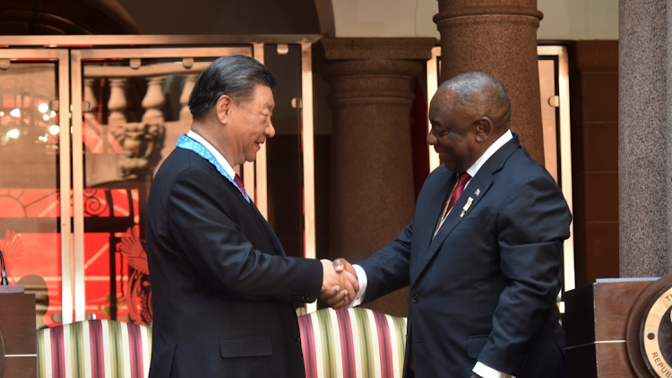 Chinese President Xi Jinping, left, greets President Cyril Ramaphosa during a state visit to South Africa at the Union Buildings in Pretoria on August 22 2023. Picture: FREDDY MAVUNDA/BUSINESS DAY