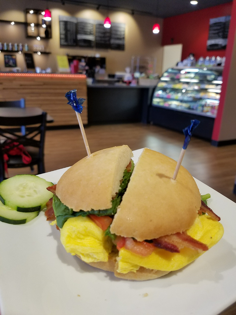 Bacon, egg, spinach,and tomatoes on a flatbread