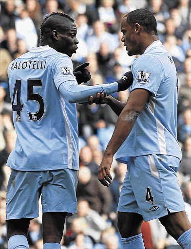 Manchester City's Vincent Kompany speaks to Mario Balotelli after the latter had argued with teammate Aleksandar Kolarov during their league match against Sunderland at Etihad stadium Picture: REUTERS