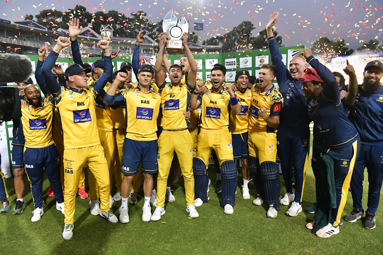 Bjorn Fortuin lifts the T20 Challenge trophy, the Lions' second title of the 2023/24 season. Picture: SYDNEY SESHIBEDI/GALLO IMAGES