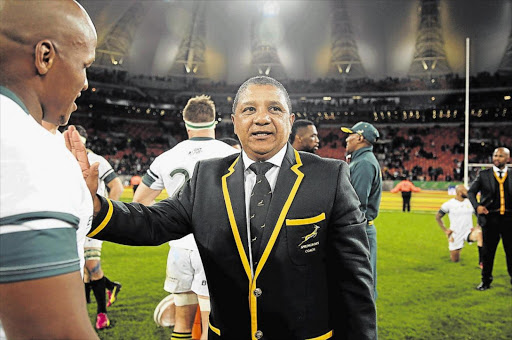 DUGOUT ARCHITECT: Springbok coach Allister Coetzee congratulating players after his team beat Ireland in the deciding Test at Nelson Mandela Bay Stadium on Saturday Picture: MARK ANDREWS