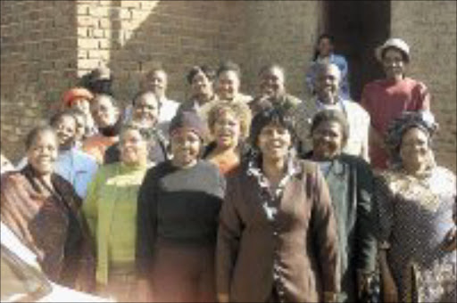 HELPING HANDS: Members of the Charlotte Maxeke Ladies Feoolwship who gave food, clothes and blankets to people from disadvantaged communities. Pic. Peter Mogaki. 14/07/07. © Sowetan.