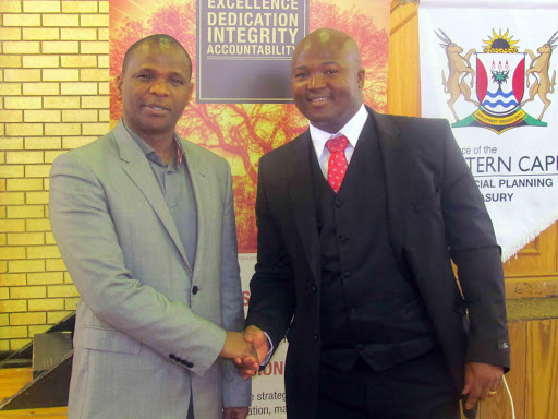 IN CHARGE: MEC for Finance Sakhumzi Somyo, left, welcomes the new head of department for provincial treasury, Daluhlanga Majeke, at a function for treasury staff yesterday in Bhisho Picture: SUPPLIED