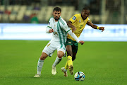 Bafana Bafana's Elias Mokwana and Houssem Aouar of Algeria compete for the ball in the Fifa Series international friendly at Stade Nelson Mandela on Tuesday.