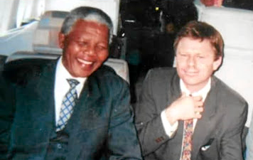 President Nelson Mandela and Patrick Bulger on route from Tokyo to Seoul, South Korea.