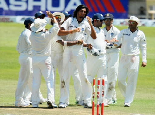 Ishant Sharma (C) and his team mates celebrate the wicket of Morne Morkel during day 4 of the 2nd Test match between South Africa and India at Sahara Stadium, Kingsmead on December 29, 2010 in Durban