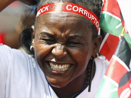 A civil society member reacts during a protest, dubbed KnockOutCorruption, against what organisers say is corruption in government, in Nairobi December 1, 2015. REUTERS