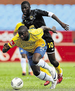 Nyasha Mushekwi of Mamelodi Sundowns wins the race for the ball against Davie Banda of Black Leopards during the PSL encounter at Loftus, which Downs won 5-1 Picture: SYDNEY SESHIBEDI