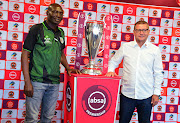 Baroka FC coach Wedson Nyirenda (L) pose for a photograph with the Absa Premiership trophy alongside his Polokwane City counterpart Jozef Vukusic during the Polokwane derby press conference at Peter Mokaba Stadium in Polokwane the on August 16 2018.