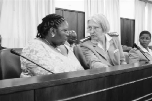 SHARING IDEAS; Correctional Services Minister Nosiviwe Mapisa-Nqakula with acting director-general of correctional services Jennyh Schreiner in Parliament yesterday. Pic. Anna Majavu. 28/01/2010. © Sowetan.