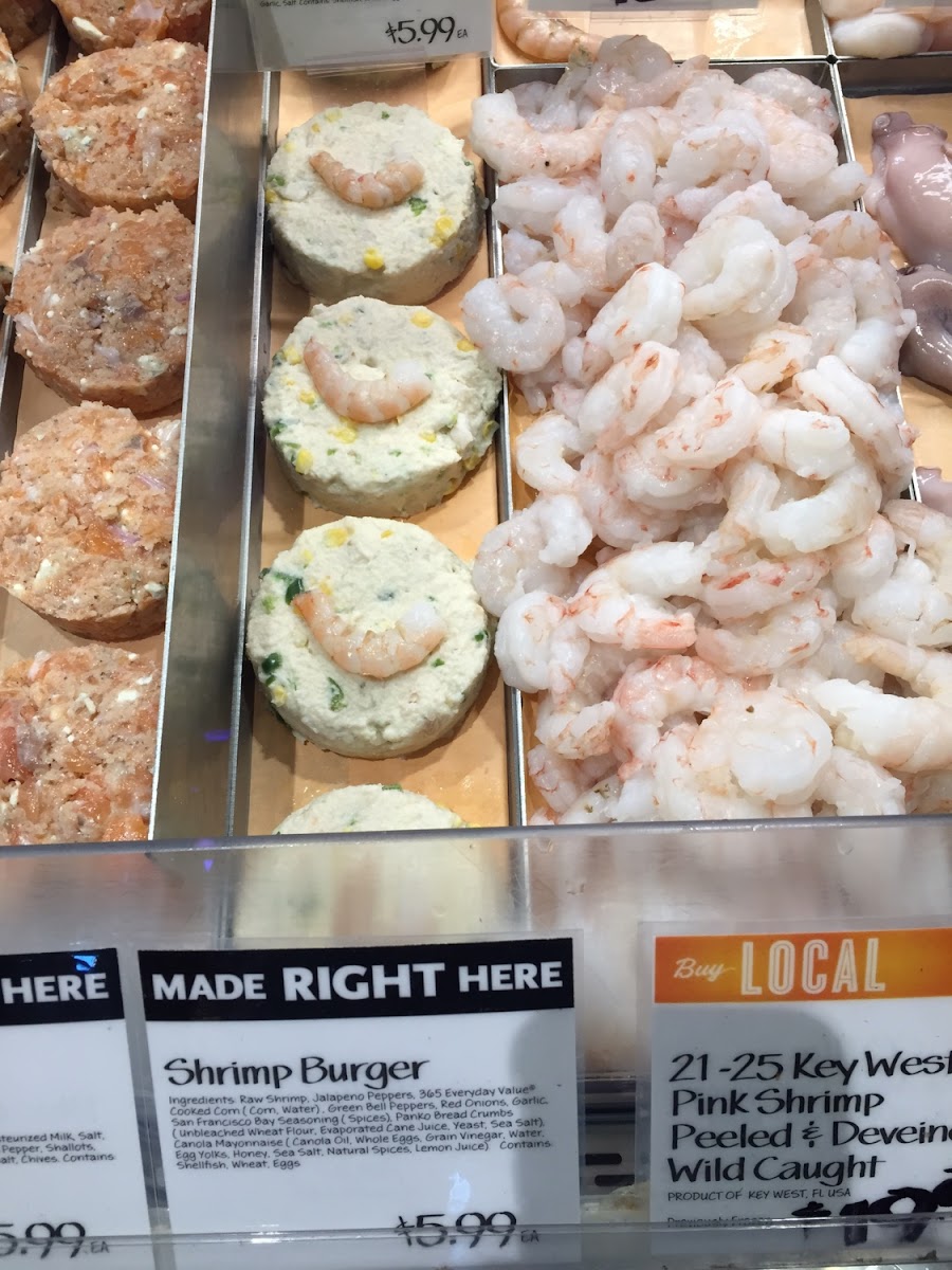 Fresh shrimp touching wheat product.