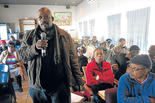 MARINE BUSINESS: Moses Nxumalo of Centane asks at yesterday’s public consultation meeting in East London how to go about getting rights to harvest oysters and mussels Picture: MIKE LOEWE