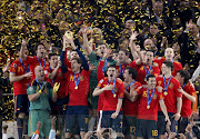 Spain's soccer team celebrates with the World Cup trophy after their final match victory over Netherlands, during the award ceremony at Soccer City stadium in Johannesburg July 11, 2010