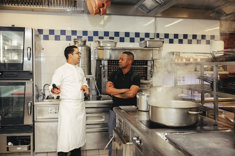 Reda Ben Hammida (left), sous chef at Plaza Athénée, gives SA chef Wandile Mabaso a kitchen tour.
