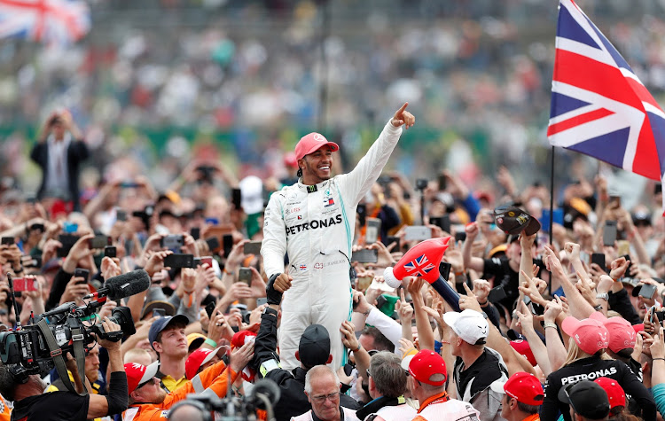 Lewis Hamilton soaks up the adulation of fans after winning this year's British Grand Prix.