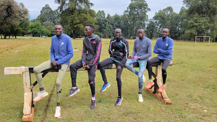 Abraham Kibiwot (2nd R) with training mates at the Kapsabet ASK showground in Nandi County