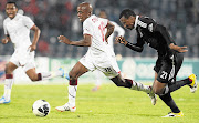 Bennett Chenene of Moroka Swallows on the offensive as Orlando Pirates defender Siyabonga Sangweni tries to close him down during the PSL encounter at Dobsonville stadium in Soweto last night. The match ended 0-0 Picture: SYDNEY SESHIBEDI