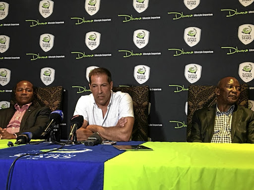 Former Platinum Stars' chairman Cliff Ramoroa, current head coach Roger de Sa and Kgosana Rapetsana at last week's announcement that the club has been bought for R22.5-m, which the writer says is far lower than what was paid for other clubs./Platinum Stars Twitter