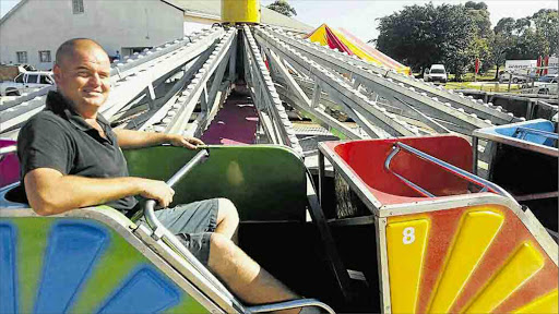 FAIR PLAY: Funfair owner Johan Ferreira has set up his rides at the East London Show, which opens at the Gonubie Farmer’s Hall today Picture: BARBARA HOLLANDS