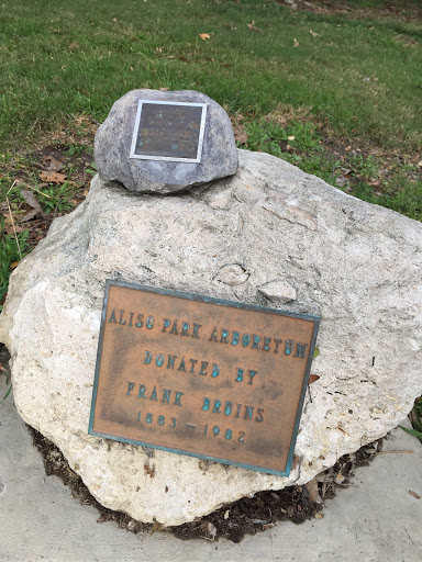 Aliso Park Arboretum  Donated by Frank Bruins 1883 - 1982   Smaller marker is new as of December 30, 2016.  Text is difficult to read:  In loving memory of Ben "Poppie" Sokolec  and  Florence...