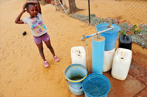 Keamogetswe Kutumela, 6yrs old. get water for their home at Magatle VIillage near Zebediela in Limpopo. Pic Veli Nhlapo/Sowetan