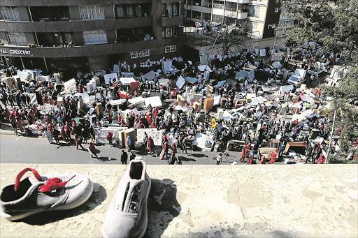 LEFT BEHIND: Hillbrow residents lost their valuables when City of Joburg’s contracted Red Ants Security Services kicked them out of their flats early yesterday. Pic: AYI LESHABANE