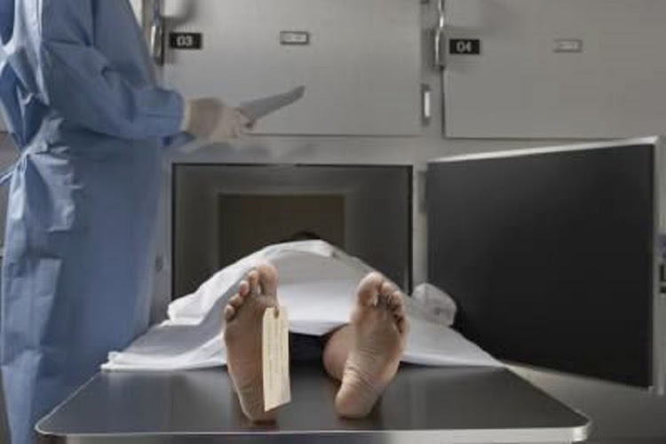 A woman was found alive in a morgue fridge.