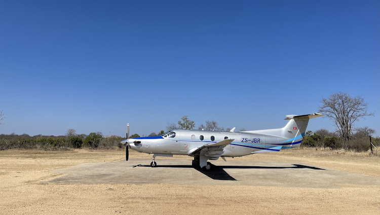 The glamorous Federal Airlines Pilatus PC- 12 on the private Jackalberry Airstrip at Royal Malewane.