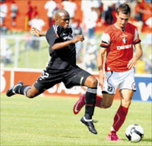 SUPERMAN: Orlando Pirates defender Lucas Thwala, left, fights for the ball with Platium Stars 's Bradley Grobler during thier Premiership match at Olympia Park in Rustenburg recently. Thwala scooped three top club awards for the recently completed season. 01/03/2009. Pic. Lefty Shivambu. © Gallo Images.