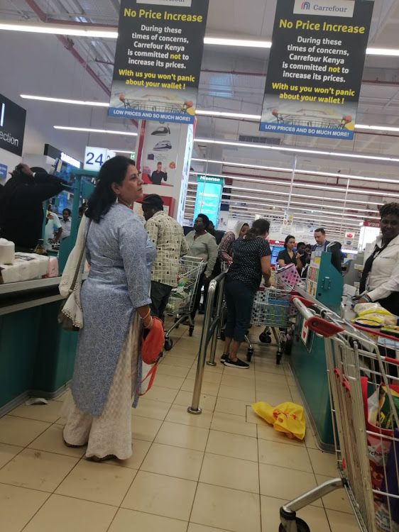 People rush to supermarkets to stock after Kenya confirmed first case of coronavirus.