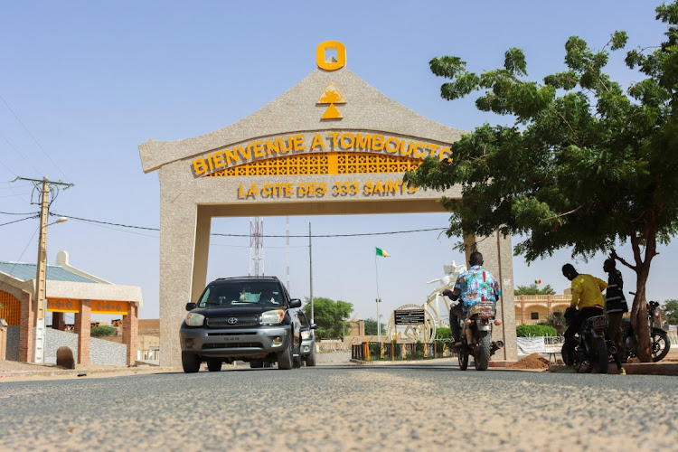 Residents drive past the entrance of Timbuktu, Mali September 29, 2023. Picture: REUTERS/Stringer