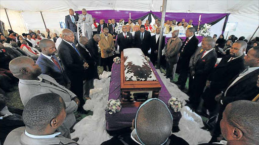 ROYAL SENDOFF: Traditional leaders surrounding the casket carrying the body of AmaMpondo's Chief Malizole Gcinizizwe Ndamase during his funeral at MaMpondomiseni Great Place in Ngqeleni yesterday Picture: LULAMILE FENI