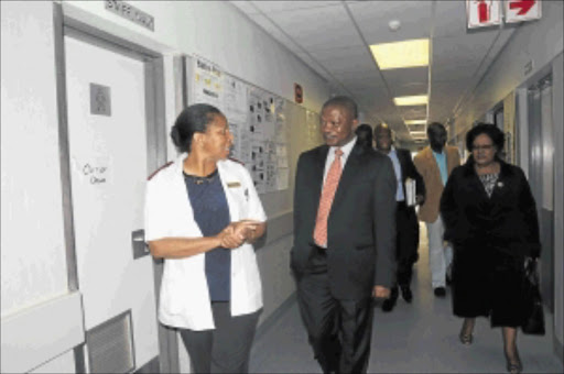 on a mission: Mpumalanga premier David Mabuza and health D -G Dr Nonhlanhla Mkhize, far right, with a nursing sister at Bernice Samuel Hospital in Delmas.