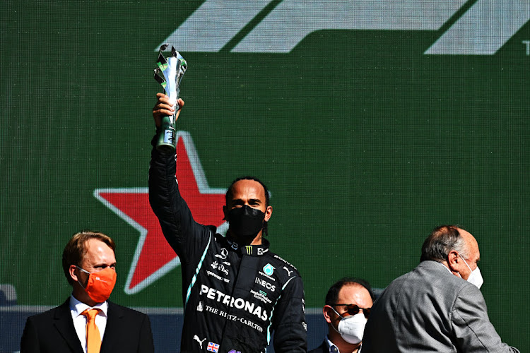 Second placed Lewis Hamilton celebrates on the podium during the F1 Grand Prix of Mexico at Autodromo Hermanos Rodriguez on November 07, 2021 in Mexico City, Mexico.