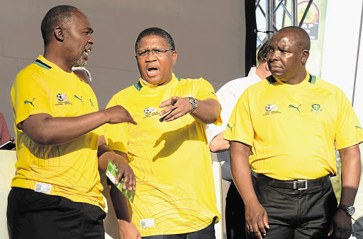 Safa deputy president Chief Mwelo Nonkonyana, left, with Minister of Sport Fikile Mbalula and former Safa head Kirsten Nematandani. Nonkonyana's role in a decision to suspend officials named in a match-fixing report resulted in his own suspension. He is set to be fired at Saturday's AGM.