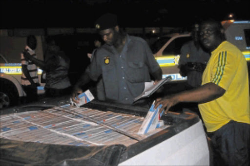 CONTRABAND: Some of the smuggled cigarettes seized costing the country billions. PHOTO: CHESTER MAKANA