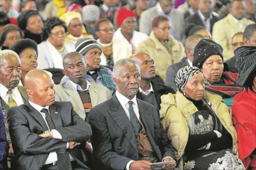 Chief Justice Mogoeng Mogoeng, left, former president Thabo Mbeki and his wife Zanele at the memorial service of Epainette Mbeki at King Hintsa FET College in Dutywa yesterday. MaMbeki, who was granted provincial official funeral, will be laid to rest at the Dutywa cemetery tomorrow Picture: LULAMILE FENI © DAILY DISPATCH