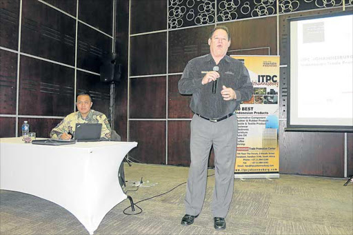 ON CENTRE-STAGE: BKCOB’s Les Holbrook, front, encourages small business operators in the Eastern Cape to look at the trade opportunities presented by Indonesian trade officials at the International Convention Centre in East London. Holbrook told the audience that many of that country’s export products were manufactured by a wide range of small businesses that made it easier to negotiate prices Picture: MIKE LOEWE