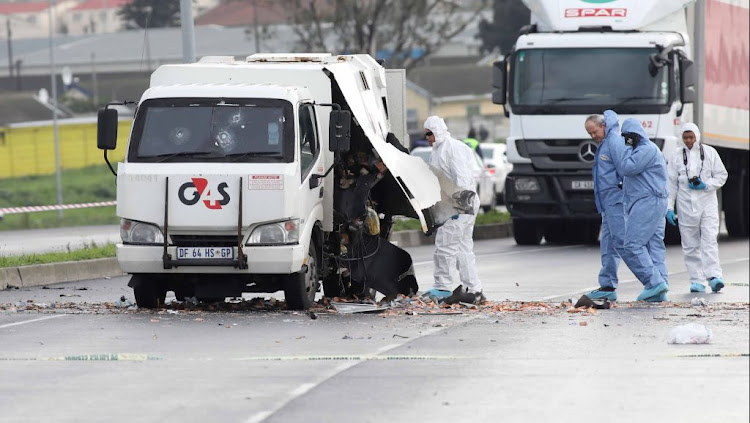 Police Forensics on the scene at a cash in transit heist on the Jakes Gerwel road in Athlone, Cape Town on June 18, 2018.