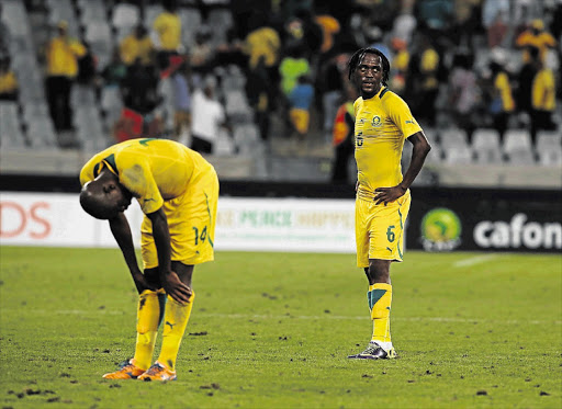 IT'S OVER: Bafana Bafana's Hlompho Kekana and Lerato Chabangu are dejected after losing 3-1 to Nigeria in their final African Nations Championships Group A match at Cape Town Stadium last night.